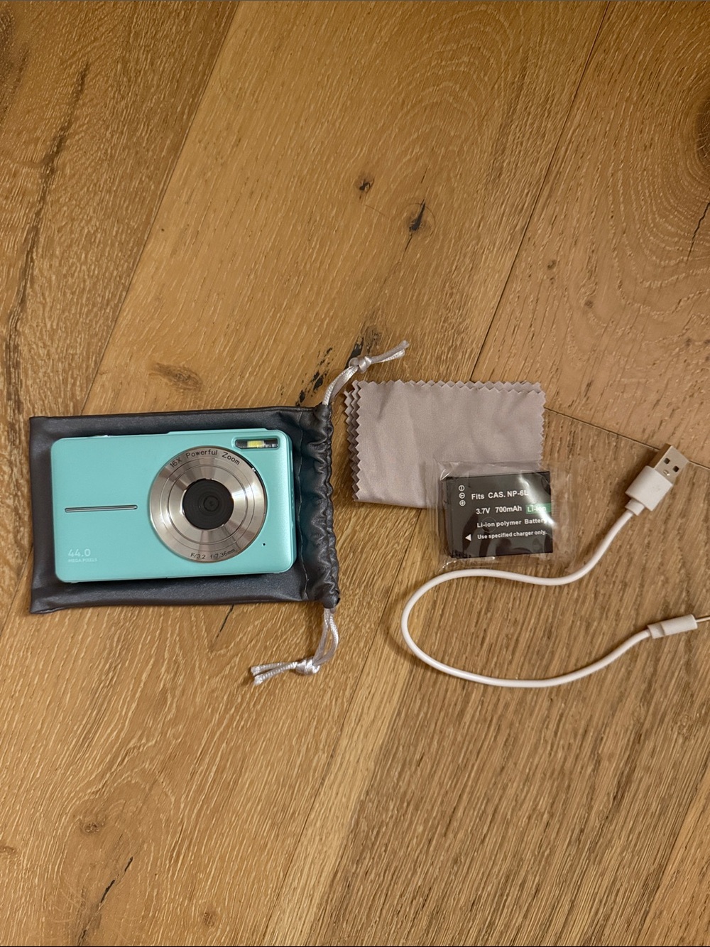 Turquoise Digital Camera with Accessories